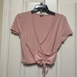 Never worn. Light pink cropped tshirt